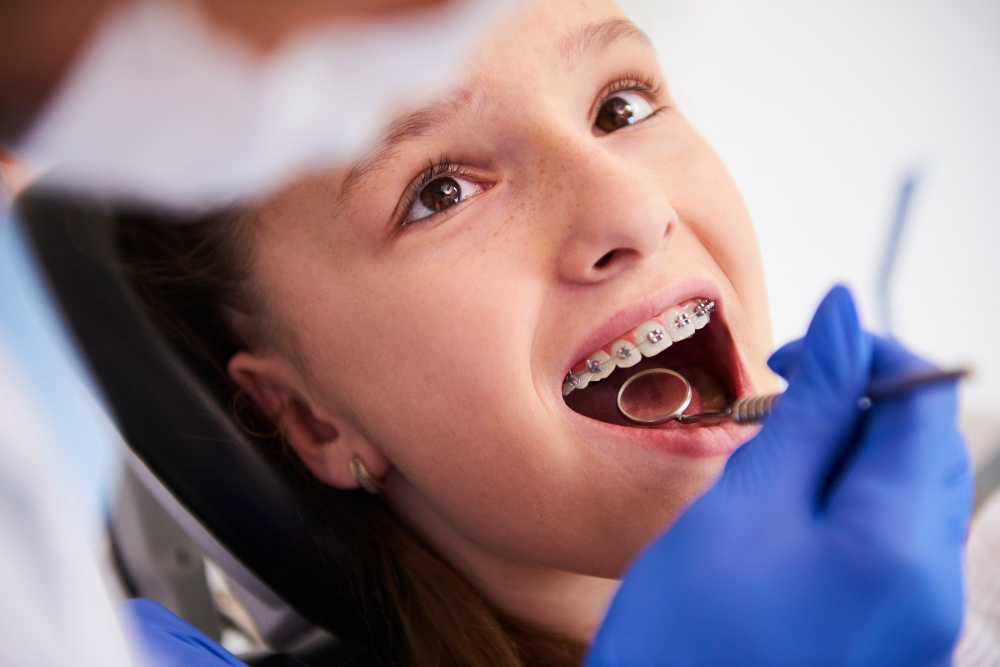 girl with braces during routine dental examination 1